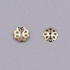 Bead cap, rose gold plated iron, 7x1mm textured flower with cutouts, fits 8-12mm bead. Sold per pkg of 200.